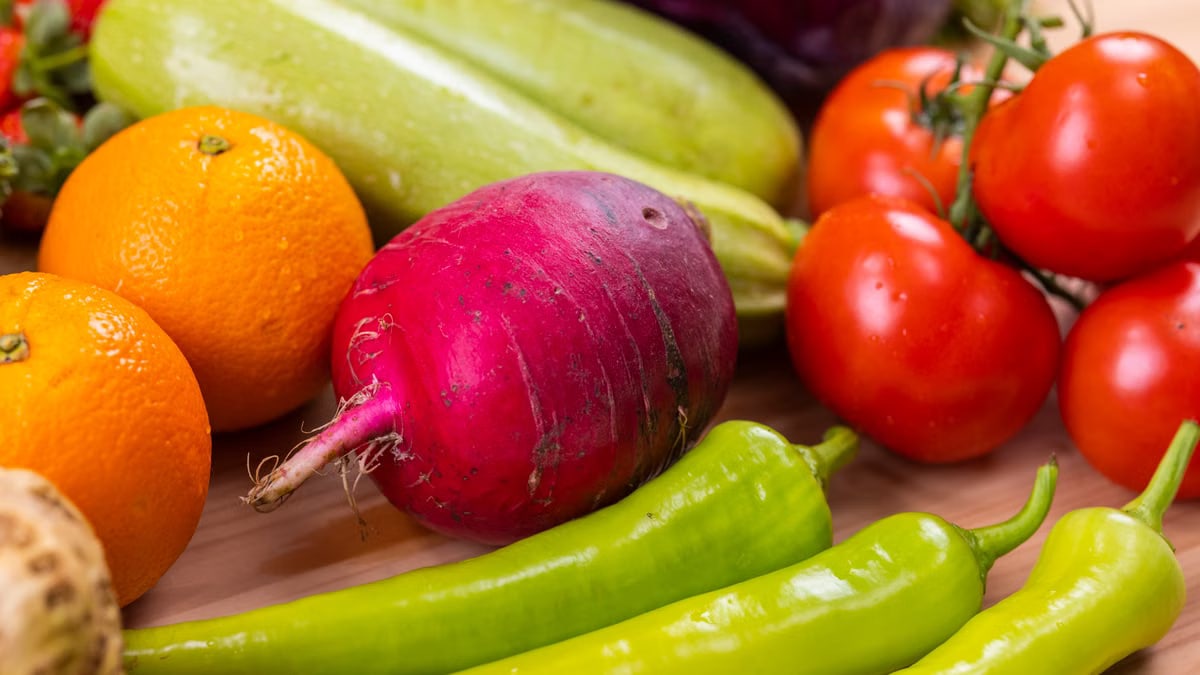 A colorful mix of fresh fruits and vegetables, showcasing organic nutrition.